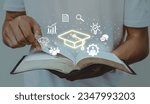 Small photo of Education concept.Male student opening book with icon.Education internet Technology.knowledge,wisdom,graduate.