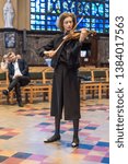 Small photo of Schaerbeek, Brussels / Belgium - 04 26 2019: Svenja Van Driessche playing the violing solo during the event around the renovation og the Saint Suzanna art deco church