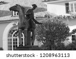 Small photo of Statue of messenger at Schloss Johannisberg in memory of first late harvest of the nobly rotten grapes which became the rule on Castle from then on. Famous courier whose delay led to the Spatlese wine
