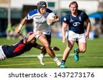 Small photo of Hong Kong - 29 June 2019: Myung Jun Lee of South Korea (C) is tackled by Matthew Rosslee of Hong Kong (L) during the Asia Rugby Championship match between Hong Kong and South Korea.