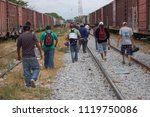 Small photo of Ixtepec, Oaxaca/Mexico-2012. Central American migrants and asylum-seekers prepare to board the freight train they call La Bestia.