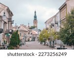 Zeromski street in Radom, Poland. Pedestrian street in the city center. Church tower of St. Jacob in the background