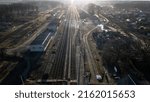 Small photo of unction and passenger railway station in sunlight. Switches and many tracks. Transport flows and transportation of goods. Cargo logistics on the railway. Aerial view, drone shot