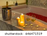 Two glasses of champagne with candle near jacuzzi. Valentines background. Romance concept. 