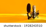 Small photo of Professional microphone with waveform on yellow background banner. Podcast or recording studio background