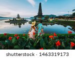 Couple spending time at the ulun datu bratan temple in Bali. Concept about exotic lifestyle wanderlust traveling