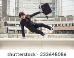 Business man with suitcase jumping over urban obstacles - Man with elegant suit running at work because in late - Concepts of business,overcoming problems,competition and urban urban life 