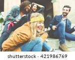 Group of four friends laughing out loud outdoor, sharing good and positive mood