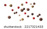 Small photo of Pepper mix of red, black, white, green and allspice peppercorns isolated on white background. Mixed hot red Pepper. peppercorns on a white background. View from directly above.