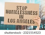 Small photo of man's hand firmly grasps a banner that reads ' Stop Homelessness in Los Angeles '. the plight of homelessness. social issues, ruin, unfortunate, public, social, destitute, insolvent