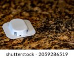 Small photo of Ant trap poison bate on a granite kitchen countertop