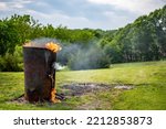 Small photo of Burn barrel in a rural area used to incinerate trash and garbage.