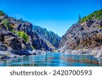 Small photo of defocused Water level view of Hellgate Canyon on the wild and scenic Rogue River