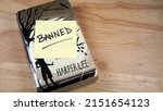 Small photo of Chicago, IL, USA - April 20 2022: A copy of Harper Lee's To Kill A Mockingbird. The book is on many schools' banned books lists in the US.