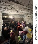 Small photo of 28.02.2022 Vinnitsa, Ukraine: evacuation of a family with children during the Russian war against Ukraine. The family is hiding in the dungeon from air strikes