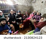 Small photo of 28.02.2022 Vinnitsa, Ukraine: evacuation of a family with children during the Russian war against Ukraine. The family is hiding in the dungeon from air strikes