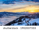 awesome winter landscape at sunset with  view from the Allgau Alps over the Bregenzer Wald in Austria to Mount Saentis in Switzerland
