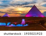 The Great Pyramids of Egypt and the Sphinx, enlighted at night, Giza