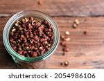 Sichuan pepper in a glass bowl view from above