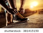 Man tying jogging shoes