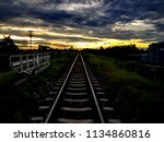 Small photo of The rail a long stretch of Joab the morning sunlight, golden color in the warm rays through the clouds of gray beautiful.
