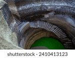 Small photo of 11 26 2006 Vintage Old Helical stepwell,UNESCO worlf Heritage well with a 1.2m-wide staircase spiralling down the wall of the well shaft, Champaner, Gujarat, India,Asia.