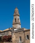Bell tower of the cathedral of Lecce, Italy, in the square of the same name seen from the Roman theater. Built between 1659 and 1670 by Giuseppe Zimbalo, with five floors and a total height of 70 m.