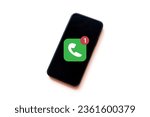Small photo of Missed call,notification concept.,Smartphone with missed call notification icon on screen over white background idea for technology,business,communication.