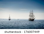 Tall Ship Sailing On Blue Water.