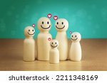 Small photo of wooden figures of family members, Family relationship symbols, A warm family, caring for family members and planning the future of children.