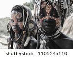 Small photo of Mago National Park, Ethiopia – August 2017: Children of the Mursi Tribe look fiercely into the lens as they are being photographed.