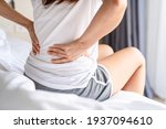 Woman Suffering From Back Ache...