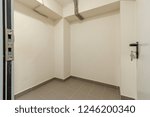 Small photo of MODERN PANTRY IS STOREROOM ON GROUND FLOOR IN MODERN RESIDENTIAL BUILDING. Bomb shelter (shelter, bombproof shelter, bombshelter, air-raid shelter).