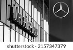 Small photo of Stockholm, Sweden: 05.08.2022: Logotype of German automotive manufacturer Mercedes-Benz, captured in black and white outside a car dealership in southern Stockholm.