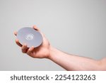 Hand holding a cd disc.