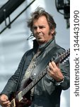 Small photo of Speedway, IN/USA - May 27, 2016: Guitarist/keyboardist Jonathan Cain performs with the rock group Journey at an outdoor concert in Indiana.