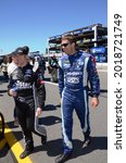 Small photo of Long Pond, PA, USA - July 30, 2017: NASCAR drivers Cole Whitt (left) and David Ragan walk to pre-race ceremonies for the 2017 Overton's 400 at Pocono Raceway in Pennsylvania.