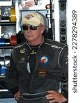 Small photo of Long Pond, PA, USA - June 4, 2010: Race driver Geoff Bodine awaits the start of practice for a NASCAR Cup Series event at Pocono Raceway in Pennsylvania.