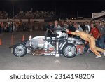 Small photo of Anderson, IN, USA - May 26, 2012: Race driver Chet Fillip makes a pit stop during the Little 500 Sprint Car race at Anderson Speedway in Indiana.