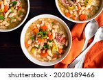 Bowls of white bean and ham...