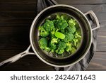 Broccoli florets on a steamer...