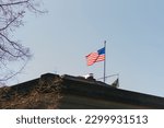 Small photo of Seattle, USA. March 2022. Flag on the building in Hiram Chittenden Locks, or Ballard Lacks, a complex of looks at the west end of Salmon Bay