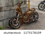 Rusty Motorcycle At The...
