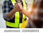 Small photo of Team architects workers hands to join forces to join forces to work for the industry for success. Teamwork and professional colleagues : Workers' hands, teamwork concept.