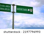 Small photo of Signboard in road. Signpost of direction in road, of green color. Signboard in road. Signpost of direction in road, of green color. Signpost in Queretaro, Mexico. Mexico.