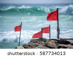 Red Warning Flag On Beach