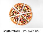 slices of fresh round pizza with chicken meat, vegetables, mushrooms and cheese top view on a white and gray background. natural shadow with copy space