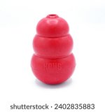 Small photo of Ocala, FL December 18, 2023 red kong Classic Dog Toy, Durable Natural Rubber Fun to Chew, Chase and Fetch. upright isolated on white background. Snow man shape satisfy instinctual needs
