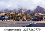 Small photo of Sedona, AZ, USA - March 24th 2023: Downtown Sedona with mountains in the background.