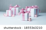 white gifts with pink ribbons.... | Shutterstock . vector #1855363210